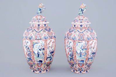 A tall pair of Dutch Delft cashmere palette vases and covers, 19th C.