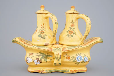 3 Dutch Delft plates and a French faience oil and vinegar set, 18/19th C.