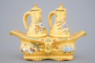3 Dutch Delft plates and a French faience oil and vinegar set, 18/19th C.