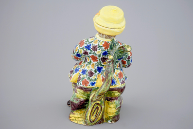 Une fontaine de table en fa&iuml;ence de Delft polychrome en forme d'homme, 18&egrave;me