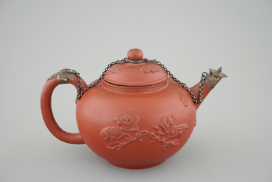A Dutch Delft Ary de Milde red earthenware teapot and cover, late 17th C.