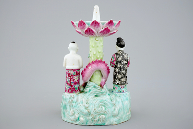 A Chinese famille rose figural candle holder, 19th C.