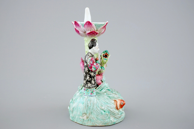 A Chinese famille rose figural candle holder, 19th C.