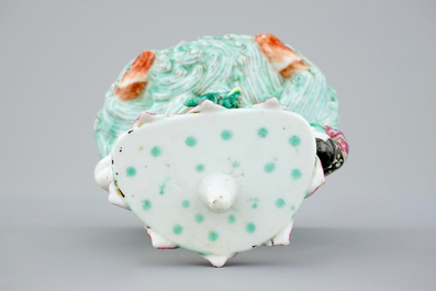 A Chinese famille rose figural candle holder, 19th C.