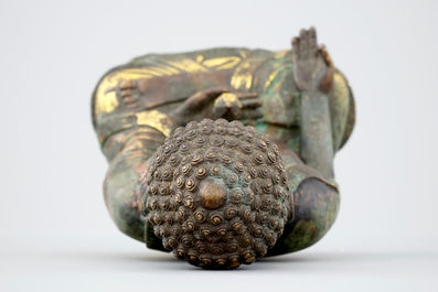 A Sino-Tibetan gilt bronze figure of a seated Buddha, 19th C.