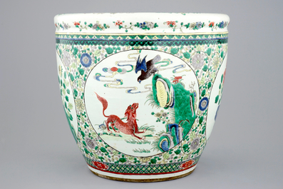 A large Chinese famille verte fish bowl with mythological animals, 19th C.
