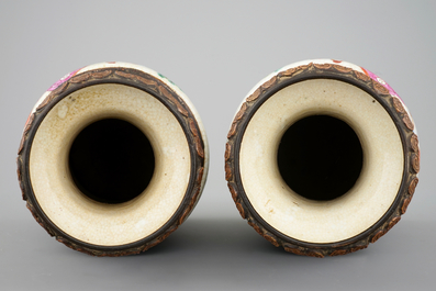 A mirrored pair of Chinese famille rose Nanking vases, 19th C.