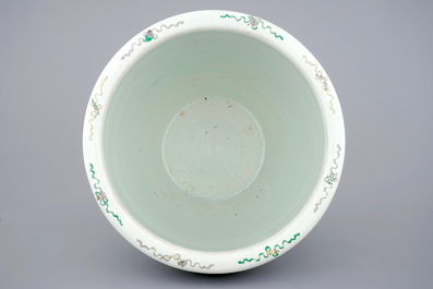 A large Chinese famille verte fish bowl with mythological animals, 19th C.