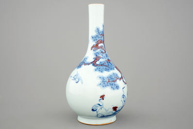 A Chinese blue and underglaze red bottle vase with cranes, 19/20th C.