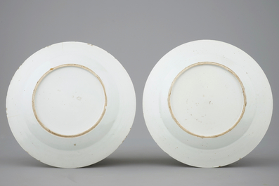 A pair of Chinese famille rose plates with peacocks, 18th C.