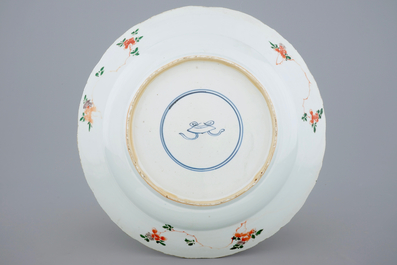 A large Chinese famille verte dish with a botanical garden, Kangxi