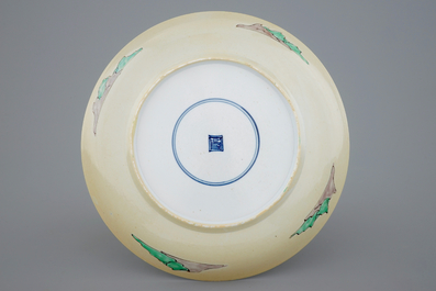 A rare Chinese famille verte caf&eacute; au lait ground landscape dish, Kangxi