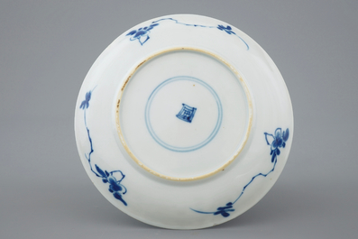 A set of five Chinese blue and white plates with flower baskets, Kangxi