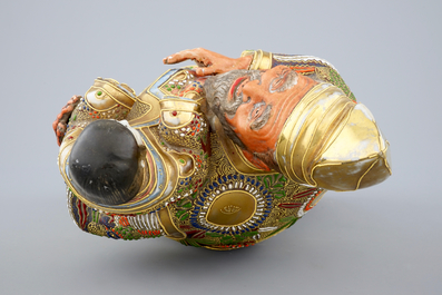 A Japanese enameled brass Ando Jubei box with cover and a large Satsuma figure, 19th C.