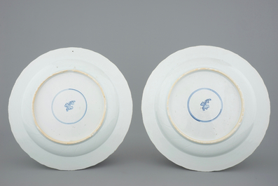 A pair of Chinese famille verte dishes with peacocks in a garden, Kangxi