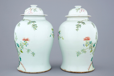 A pair of Chinese famille rose quail vases with covers, 19th C.