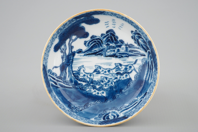 A Chinese blue and white cup and saucer with dogs, Qianlong, 18th C.