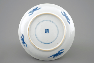 A rare Chinese blue and white Kangxi cup and saucer with French text, Kangxi