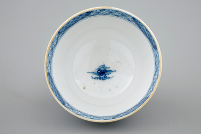 A Chinese blue and white cup and saucer with dogs, Qianlong, 18th C.