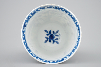 A rare Chinese blue and white Kangxi cup and saucer with French text, Kangxi