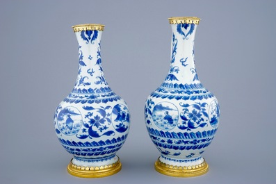 A pair of  Chinese blue and white gilt-bronze mounted jugs, Transitional period, 1620-1683