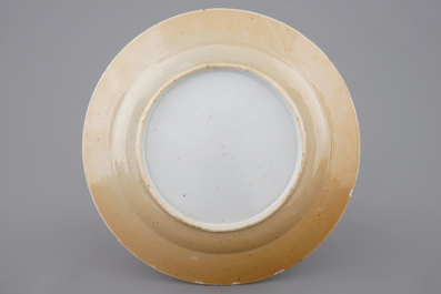 A Chinese famille verte caf&eacute; au lait ground plate with precious objects, Kangxi