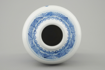 A blue and white Chinese vase with a mountainous landscape, Kangxi