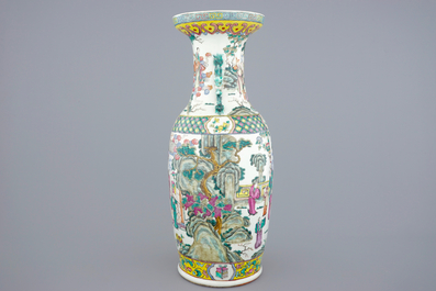 A tall Chinese famille rose vase with a garden scene, 19th C.