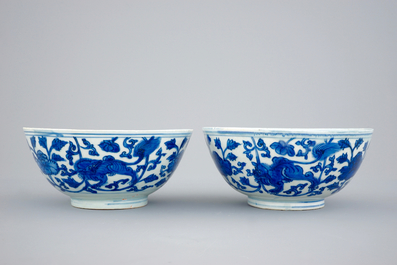 A pair of Chinese blue and white bowls with lions among peony scrolls, late Ming Dynasty
