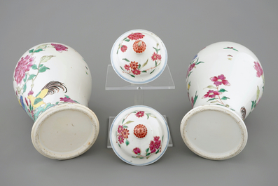 A pair of Chinese famille rose rooster vases and covers, 18/19th C.