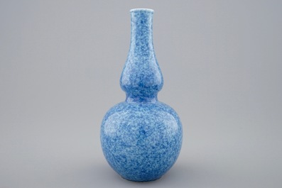 A Chinese monochrome powder blue double gourd vase, 18/19th C.