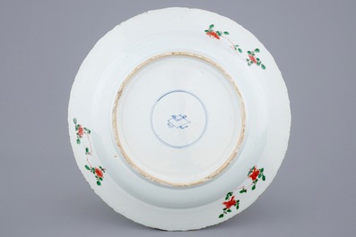 A large Chinese famille verte dish with a central flower basket, Kangxi