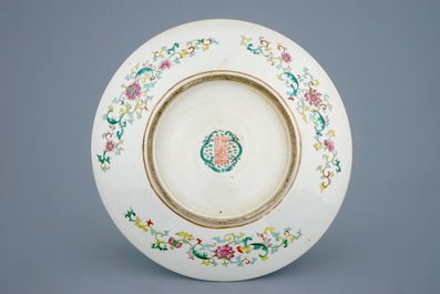 A Chinese turquoise ground famille rose charger with animals, 19th C.
