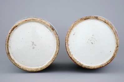 A fine pair of tall Chinese famille rose vases with birds, grapes and flowers, 19th C.