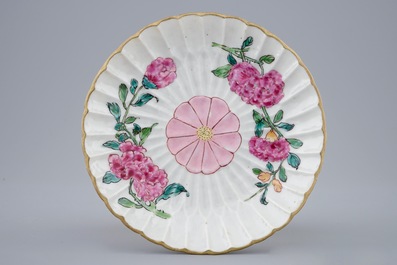 A Chinese famille rose lotus-shaped cup and saucer, Yongzheng, 1723-1735