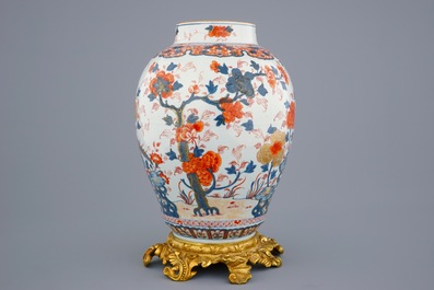 A large Chinese Imari-style export porcelain vase on gilt bronze foot, 18th C.