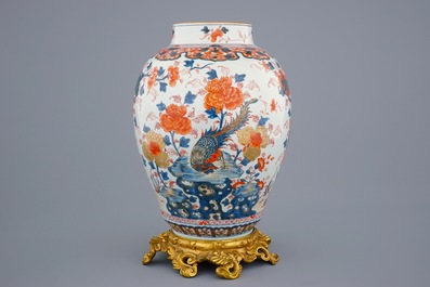 A large Chinese Imari-style export porcelain vase on gilt bronze foot, 18th C.