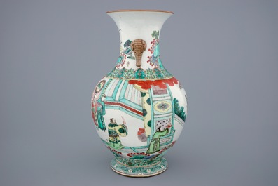 A large Chinese famille verte vase with a continuous scene and elephant handles, 19th C.