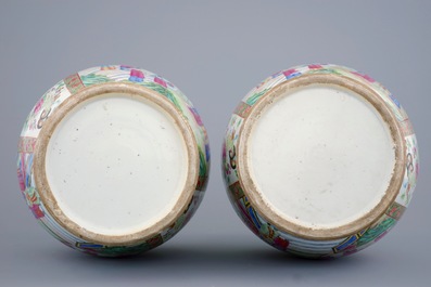 A pair of Chinese Canton famille rose vases with ruyi scepter handles, 19th C.