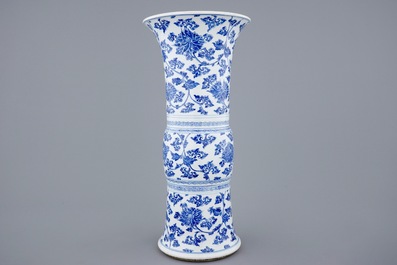 A Chinese blue and white lotus scroll gu beaker vase, Kangxi
