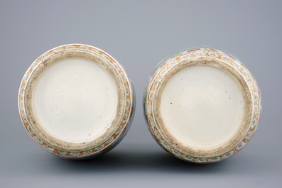 An excellent pair of Chinese Canton famille rose vases with duck handles, 19th C.