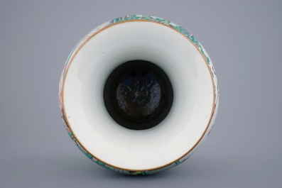 A large Chinese famille verte vase with a continuous scene and elephant handles, 19th C.