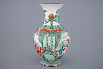 A large Chinese famille verte vase with a continuous scene and elephant handles, 19th C.
