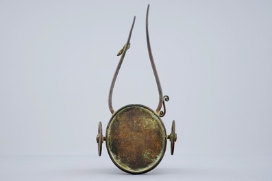 An unusual Chinese bronze vase on a chariot base, late Ming to Qing Dynasty