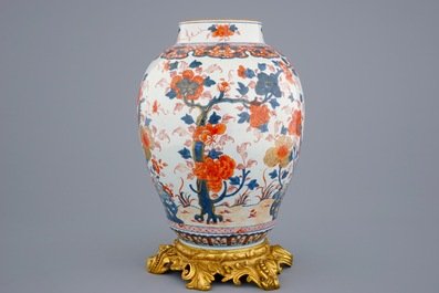 A large Chinese Imari-style export porcelain vase on gilt bronze foot, 18th C.