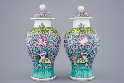A pair of Chinese famille rose vases and covers, 19/20th C.