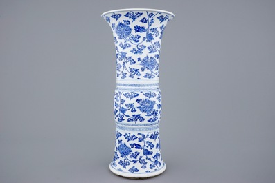 A Chinese blue and white lotus scroll gu beaker vase, Kangxi