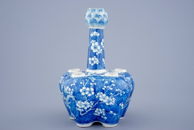 A Chinese blue and white tulip vase with prunus design, 19th C.