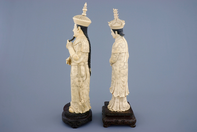 A tall pair of Chinese carved ivory emperor figures, ca. 1900