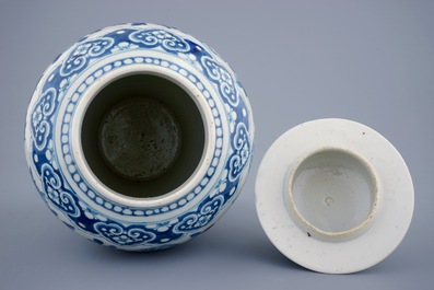 A Chinese blue and white vase and cover with dragons and peonies, 19th C.